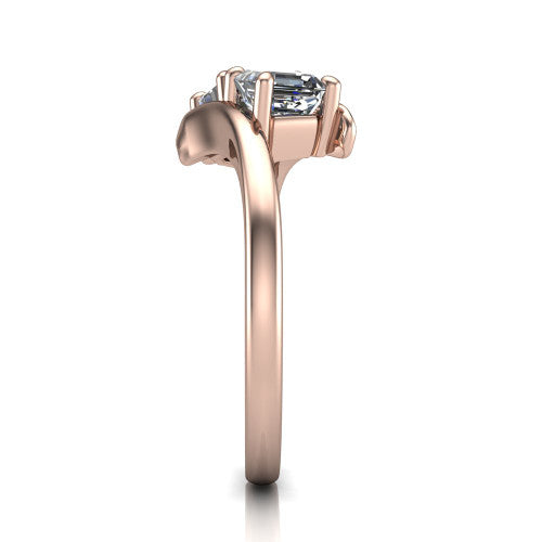 Alayna asscher three stone engagement ring in 14K Rose Gold, side profile showing the bypass swirl shoulders crossing beneath the two-stone head