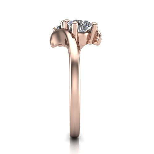 Alayna round three stone engagement ring in 14K Rose Gold, side profile showing the bypass swirl shoulders crossing beneath the two-stone head