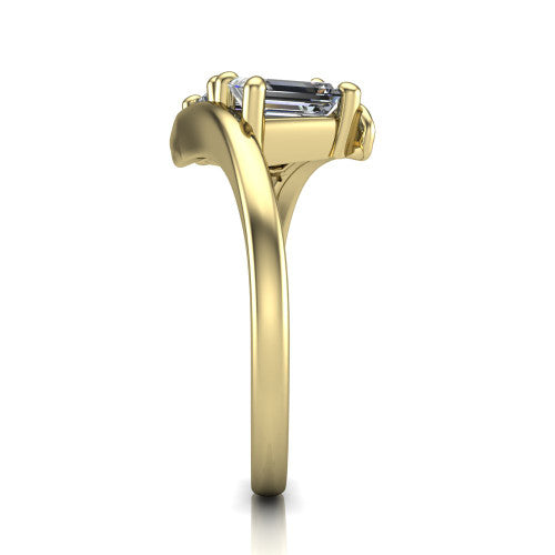 Alayna emerald three stone engagement ring in 14K Yellow Gold, side profile showing the bypass swirl shoulders crossing beneath the two-stone head