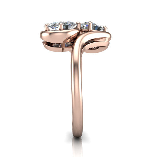 Daniela oval three stone engagement ring in 14K Rose Gold, side profile showing the bypass shank sweeping up and crossing behind the two-stone head