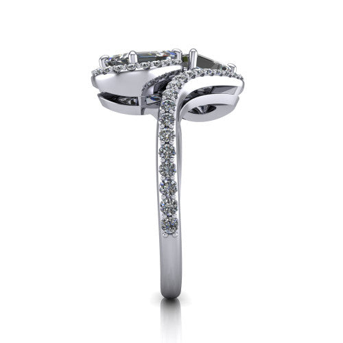 Jane emerald three stone engagement ring in Platinum, side profile showing the bypass swirling shoulders and pave diamonds wrapping the top and outer sides of the shank