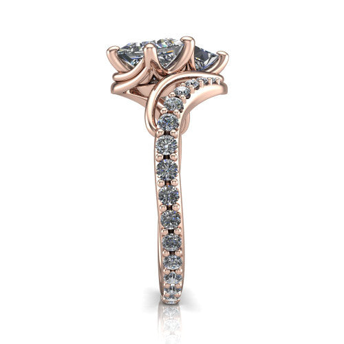 Gwen princess three stone engagement ring in 18K Rose Gold, side profile showing the bypass curving shoulders and pave diamonds wrapping the top and outer sides of the shank
