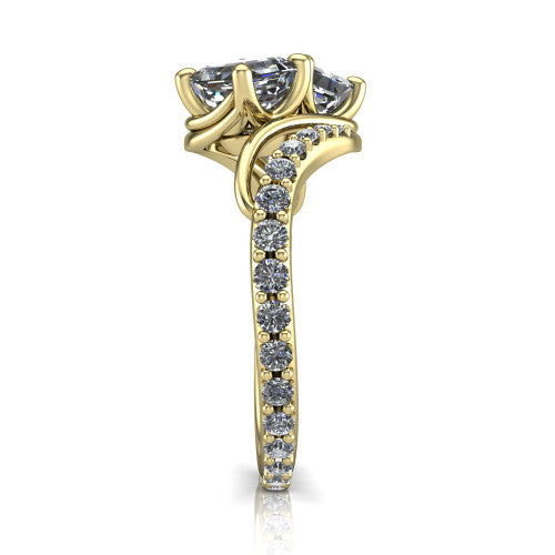 Gwen square emerald three stone engagement ring in 18K Yellow Gold, side profile showing the bypass curving shoulders and pave diamonds wrapping the top and outer sides of the shank