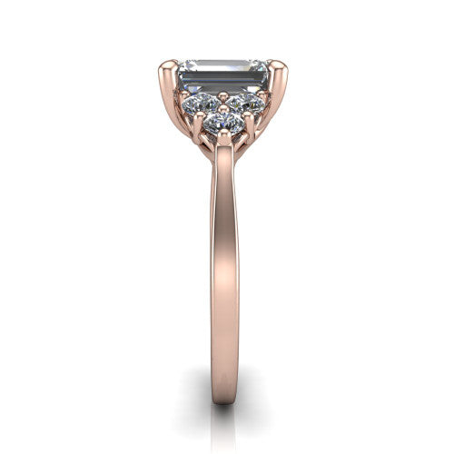 Raegan emerald three stone engagement ring in 18K Rose Gold, side profile showing the cluster head, tall basket, and slim polished band