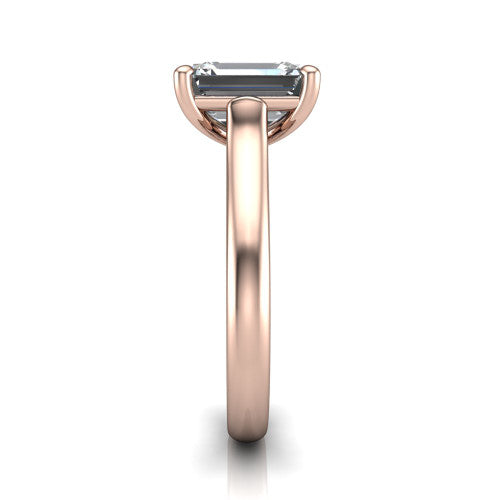Madilyn emerald solitaire engagement ring in 18K Rose Gold, side profile showing the hidden pave accent under the basket and slim polished plain band