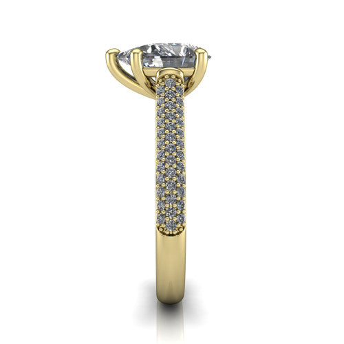 Izabella pear solitaire engagement ring in 18K Yellow Gold, side profile showing the 3-sided micropave diamonds wrapping the top and outer sides of the shank
