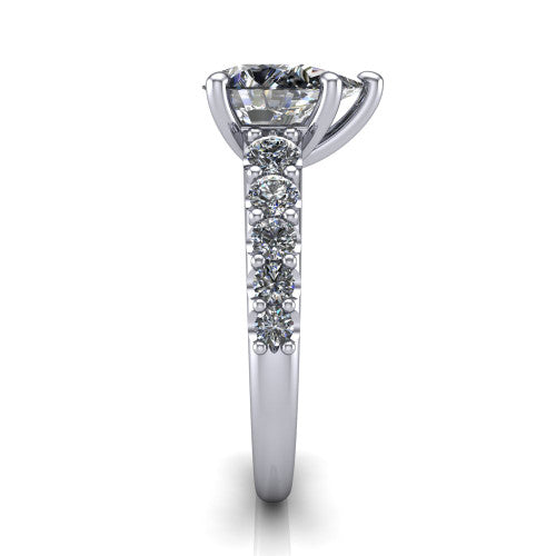 Nina pear solitaire engagement ring in 18K White Gold, side profile showing the hidden under-halo beneath the center stone and pave diamonds along the shoulders