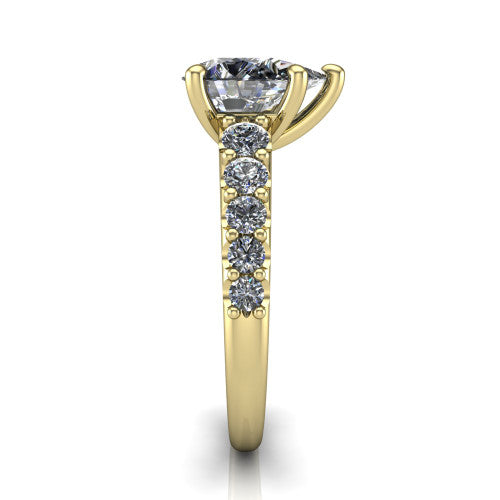 Nina pear solitaire engagement ring in 18K Yellow Gold, side profile showing the hidden under-halo beneath the center stone and pave diamonds along the shoulders