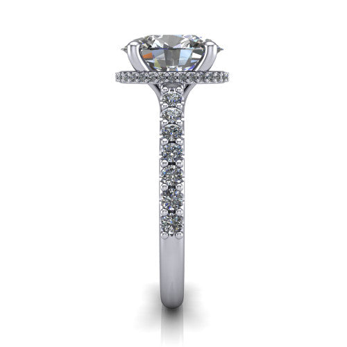 Nadia oval hidden halo engagement ring in 18K White Gold, side profile showing the hidden pave halo under the center stone and pave diamonds running continuously around the shank