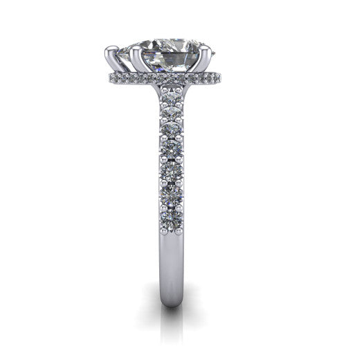 Nadia pear hidden halo engagement ring in Platinum, side profile showing the hidden pave halo under the center stone and pave diamonds running continuously around the shank