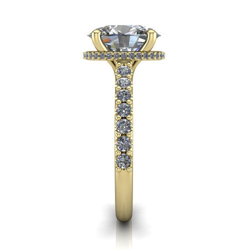 Nadia oval hidden halo engagement ring in 18K Yellow Gold, side profile showing the hidden pave halo under the center stone and pave diamonds running continuously around the shank