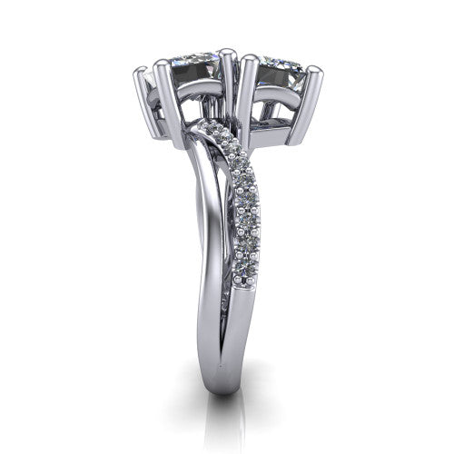 Julieta emerald three stone engagement ring in Platinum, side profile showing the bypass split shank arms with pave diamonds running along both bands