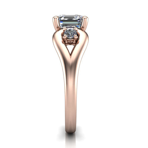 Imani square emerald three stone engagement ring in 14K Rose Gold, side profile showing the bypass loop shoulders curving through the square side frames and slim polished band