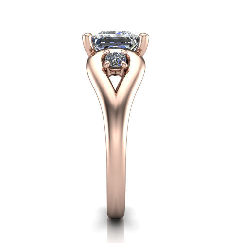 Imani princess three stone engagement ring in 18K Rose Gold, side profile showing the bypass loop shoulders curving through the square side frames and slim polished band