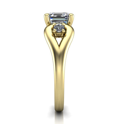 Imani square emerald three stone engagement ring in 18K Yellow Gold, side profile showing the bypass loop shoulders curving through the square side frames and slim polished band