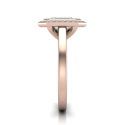 Rosie emerald halo bezel-set engagement ring in 18K Rose Gold — side profile showing the bezel-set emerald-cut center stone, halo silhouette, and slim cathedral shank