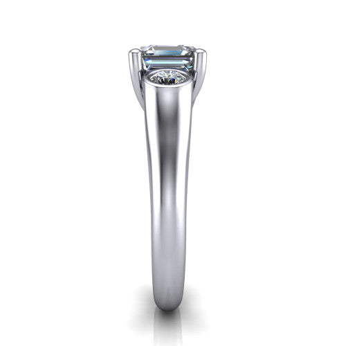 Rory square emerald three stone engagement ring in 18K White Gold, side profile showing the bezel side stones and polished band