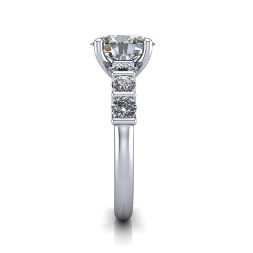 Liora oval solitaire engagement ring in Platinum, side profile showing the side accents and polished band