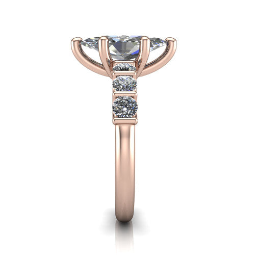 Liora marquise solitaire engagement ring in 18K Rose Gold, side profile showing the side accents and polished band