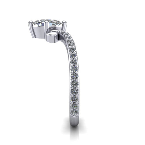 Aveline oval solitaire engagement ring in 18K White Gold, side profile showing the peaked chevron pave band