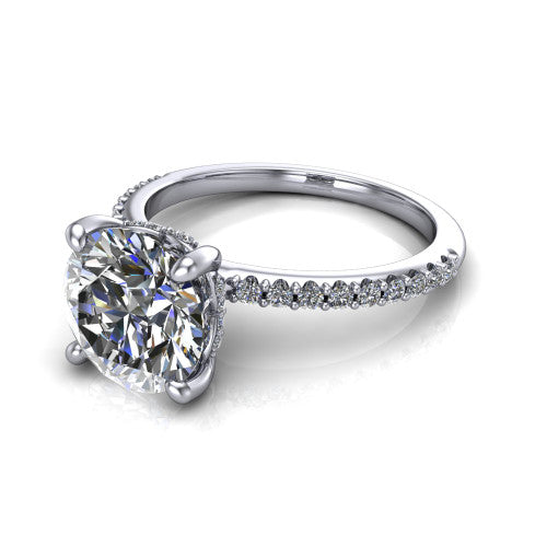 Arielle round classic engagement ring in Platinum, three-quarter perspective showing the four-prong center above a pav&eacute; band with a hidden halo collar