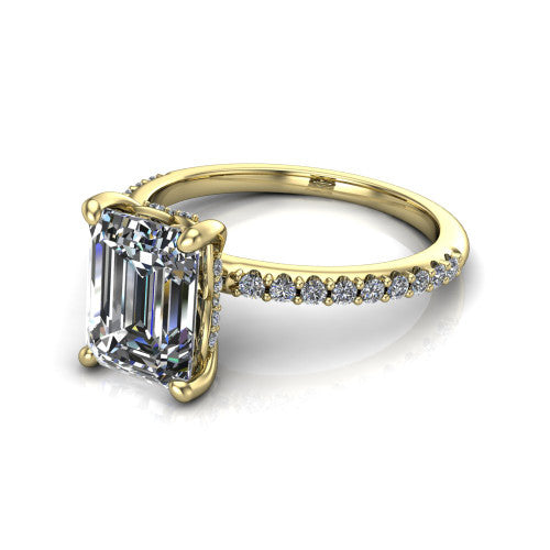 Arielle emerald classic engagement ring in 14K Yellow Gold, three-quarter perspective showing the four-prong center above a pav&eacute; band with a hidden halo collar