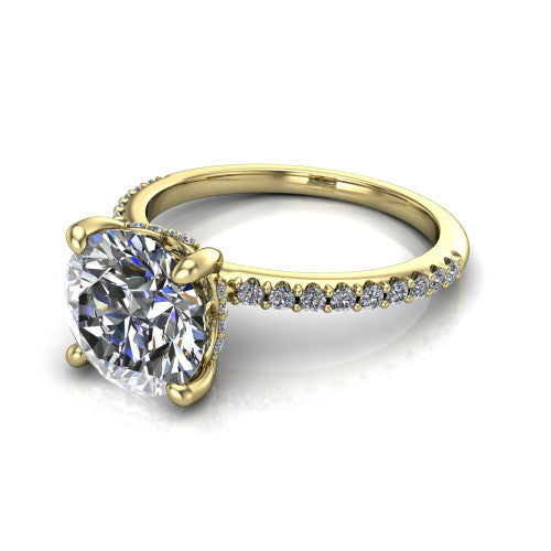 Arielle round classic engagement ring in 18K Yellow Gold, three-quarter perspective showing the four-prong center above a pav&eacute; band with a hidden halo collar