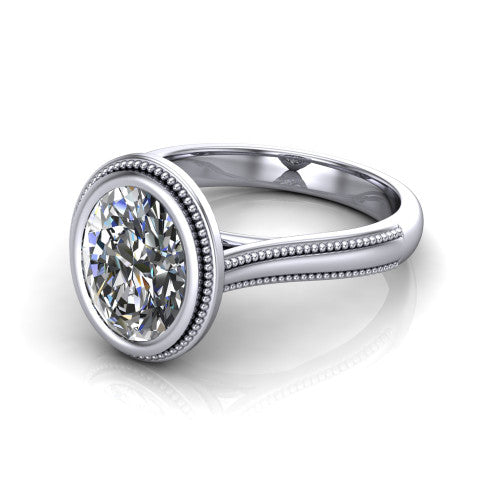 Adelina oval solitaire engagement ring in 14K White Gold, three-quarter perspective showing the brilliant oval center diamond, full bezel setting with milgrain detail, and tapered split-shoulder shank