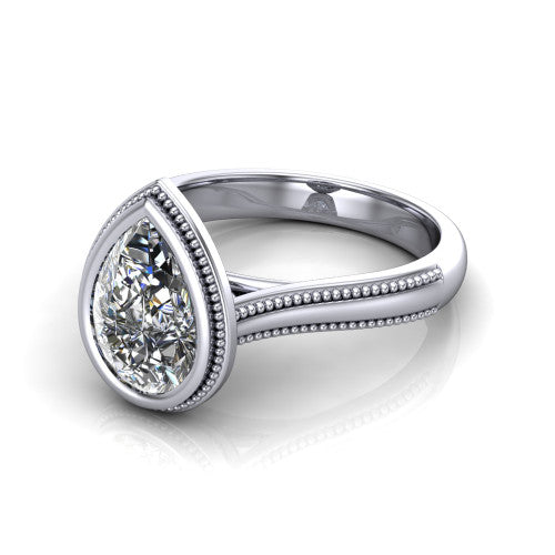 Adelina pear solitaire engagement ring in 14K White Gold, three-quarter perspective showing the brilliant pear-cut center diamond, full bezel setting with milgrain detail, and tapered split-shoulder shank