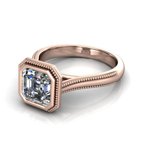 Adelina square emerald solitaire engagement ring in 18K Rose Gold, three-quarter perspective showing the step-cut square emerald center diamond, full bezel setting with milgrain detail, and tapered split-shoulder shank