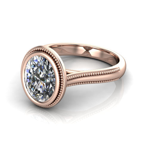 Adelina oval solitaire engagement ring in 14K Rose Gold, three-quarter perspective showing the brilliant oval center diamond, full bezel setting with milgrain detail, and tapered split-shoulder shank