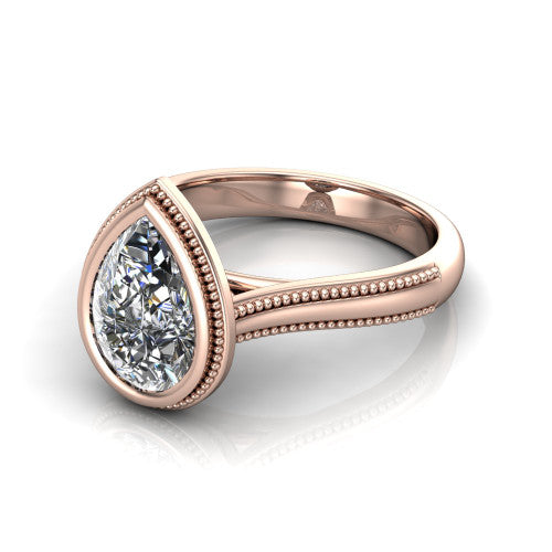 Adelina pear solitaire engagement ring in 18K Rose Gold, three-quarter perspective showing the brilliant pear-cut center diamond, full bezel setting with milgrain detail, and tapered split-shoulder shank
