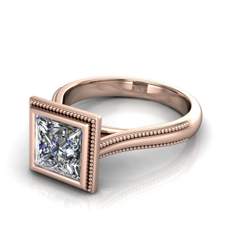 Adelina princess solitaire engagement ring in 18K Rose Gold, three-quarter perspective showing the brilliant princess-cut center diamond, full bezel setting with milgrain detail, and tapered split-shoulder shank