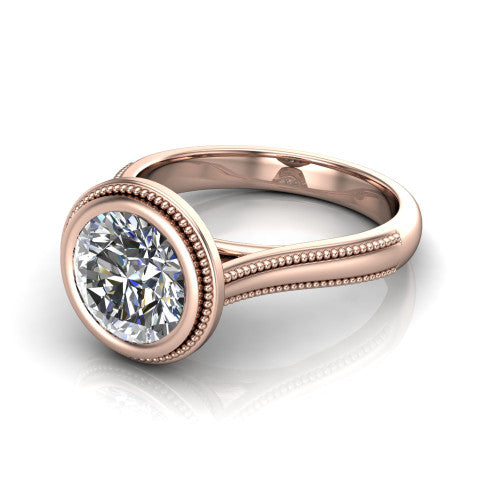 Adelina round solitaire engagement ring in 14K Rose Gold, three-quarter perspective showing the brilliant round center diamond, full bezel setting with milgrain detail, and tapered split-shoulder shank