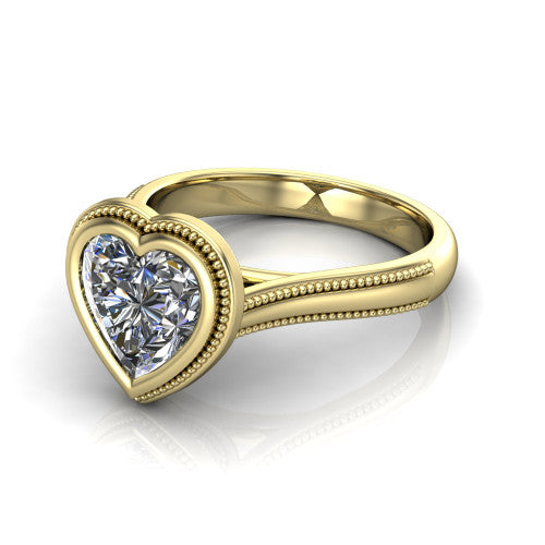 Adelina heart solitaire engagement ring in 14K Yellow Gold, three-quarter perspective showing the brilliant heart-cut center diamond, full bezel setting with milgrain detail, and tapered split-shoulder shank