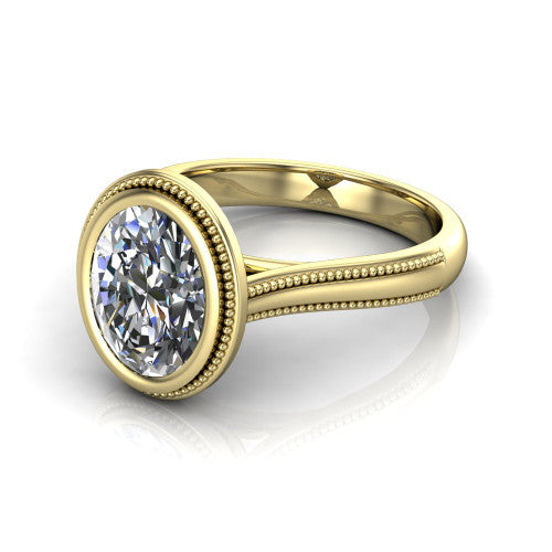 Adelina oval solitaire engagement ring in 18K Yellow Gold, three-quarter perspective showing the brilliant oval center diamond, full bezel setting with milgrain detail, and tapered split-shoulder shank