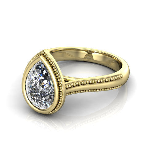 Adelina pear solitaire engagement ring in 14K Yellow Gold, three-quarter perspective showing the brilliant pear-cut center diamond, full bezel setting with milgrain detail, and tapered split-shoulder shank