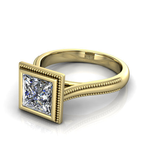 Adelina princess solitaire engagement ring in 14K Yellow Gold, three-quarter perspective showing the brilliant princess-cut center diamond, full bezel setting with milgrain detail, and tapered split-shoulder shank