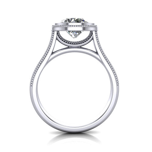 Adelina round solitaire engagement ring in Platinum, through-finger front profile showing the low-profile bezel head and open cathedral under-gallery