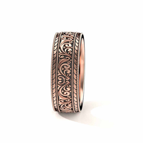 Handcrafted men's rose gold wedding band featuring antiqued black finish, scrollwork designs, and engraved borders