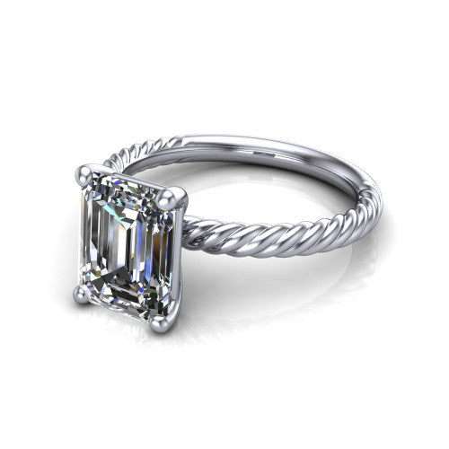 Claire emerald classic solitaire engagement ring in 14K White Gold — three-quarter perspective showing the emerald-cut center diamond, 4-prong setting, and twisted rope shank