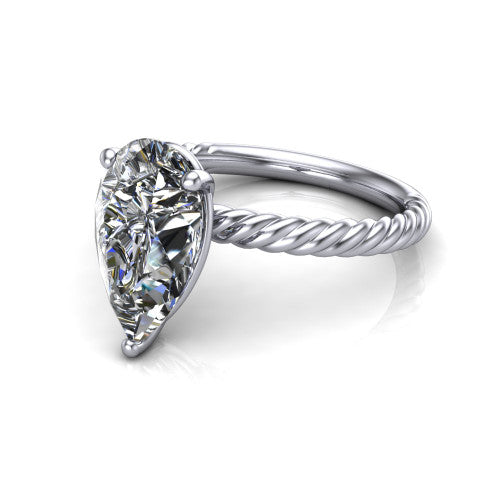 Claire pear classic solitaire engagement ring in 18K White Gold — three-quarter perspective showing the pear-cut center diamond, 4-prong setting, and twisted rope shank