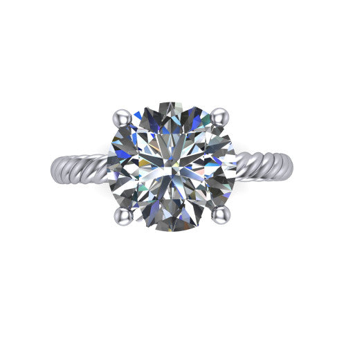 Claire round classic solitaire engagement ring in 18K White Gold — top-down view showing the brilliant round center stone and four prongs