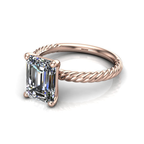 Claire emerald classic solitaire engagement ring in 14K Rose Gold — three-quarter perspective showing the emerald-cut center diamond, 4-prong setting, and twisted rope shank