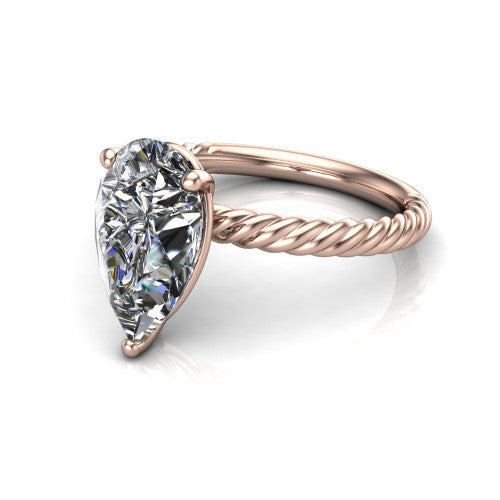 Claire pear classic solitaire engagement ring in 18K Rose Gold — three-quarter perspective showing the pear-cut center diamond, 4-prong setting, and twisted rope shank
