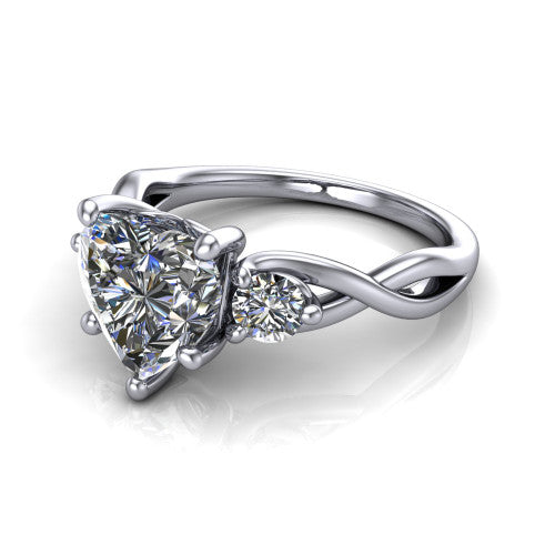 Lydia heart three stone engagement ring in 14K White Gold, three-quarter perspective showing the brilliant heart-shaped center diamond flanked by two round side diamonds on a woven infinity shank
