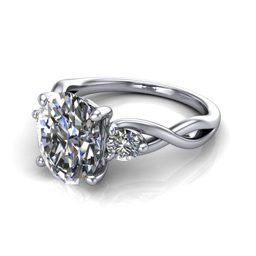 Lydia oval three stone engagement ring in 18K White Gold, three-quarter perspective showing the brilliant oval center diamond flanked by two round side diamonds on a woven infinity shank