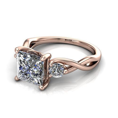 Lydia princess three stone engagement ring in 14K Rose Gold, three-quarter perspective showing the brilliant princess-cut center diamond flanked by two round side diamonds on a woven infinity shank