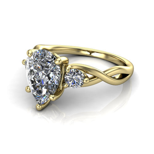Lydia pear three stone engagement ring in 14K Yellow Gold, three-quarter perspective showing the brilliant pear-cut center diamond flanked by two round side diamonds on a woven infinity shank