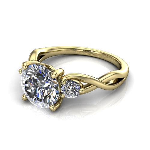 Lydia round three stone engagement ring in 18K Yellow Gold, three-quarter perspective showing the brilliant round center diamond flanked by two round side diamonds on a woven infinity shank